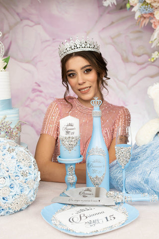 Light blue quinceanera brindis package with bottle and candle