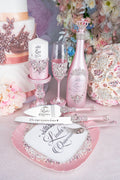 Pink quinceanera brindis package with bottle and candle