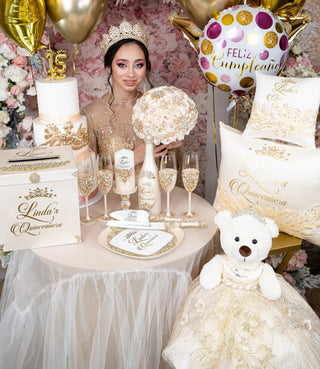 Gold quinceanera brindis package with bottle and candle